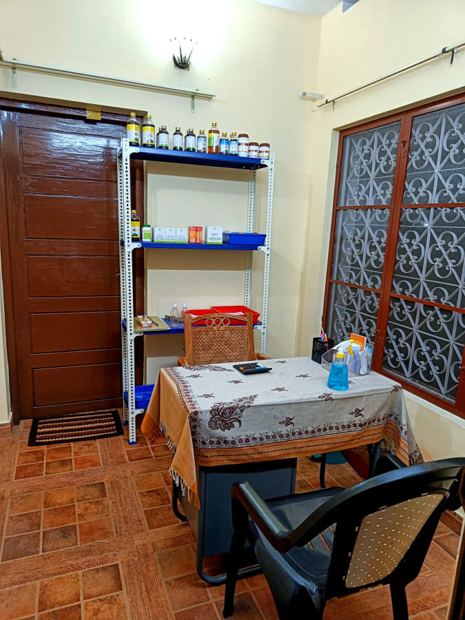 Shelves of prepared medicines beside a consulting table