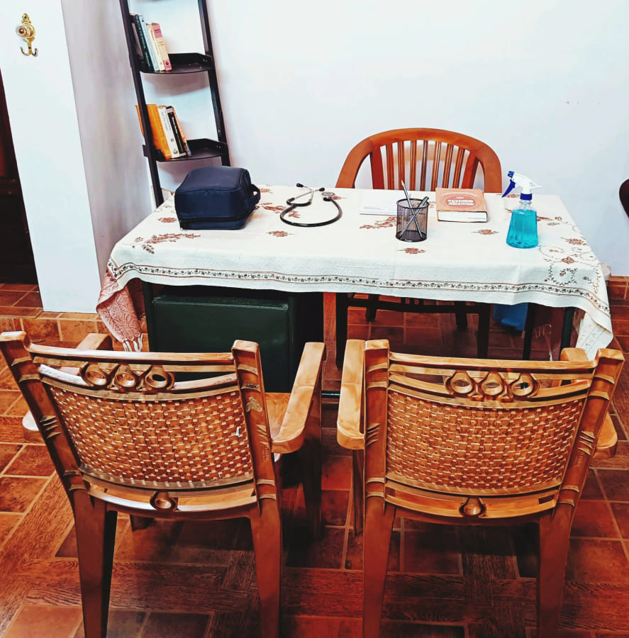 Dining table laid for guests in the ashram dining room