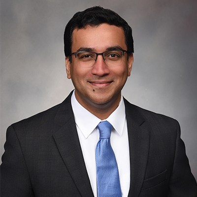 Portrait of Dr. Girish Nair, professor and physician-scientist