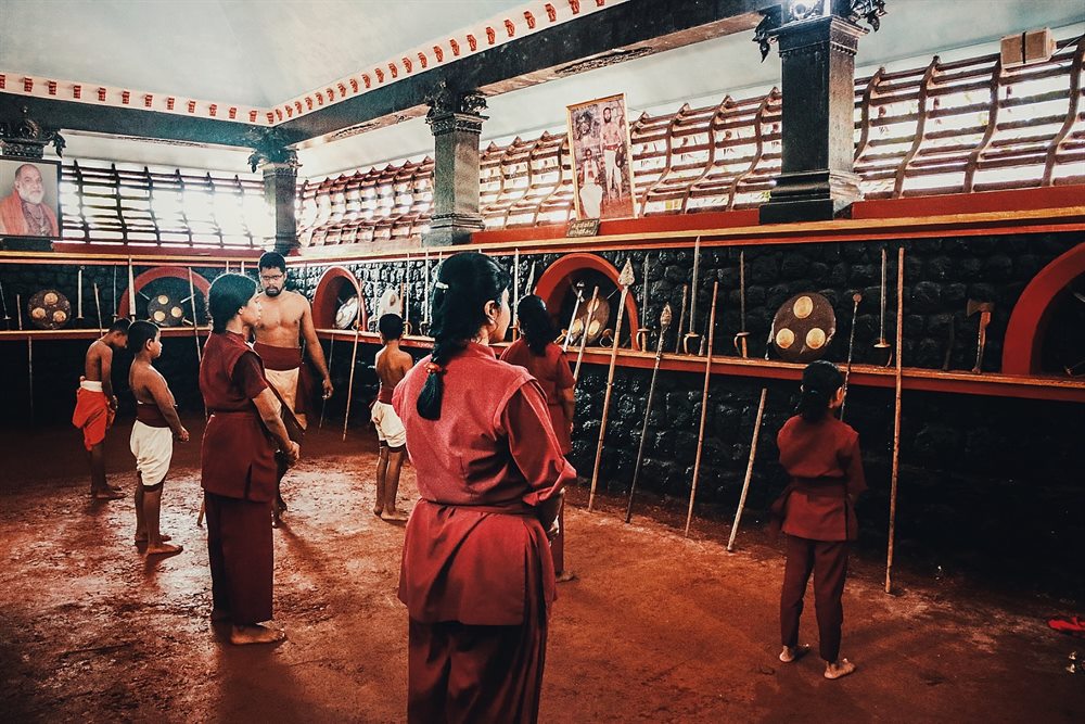 Students gathered on the earthen floor at the beginning of class