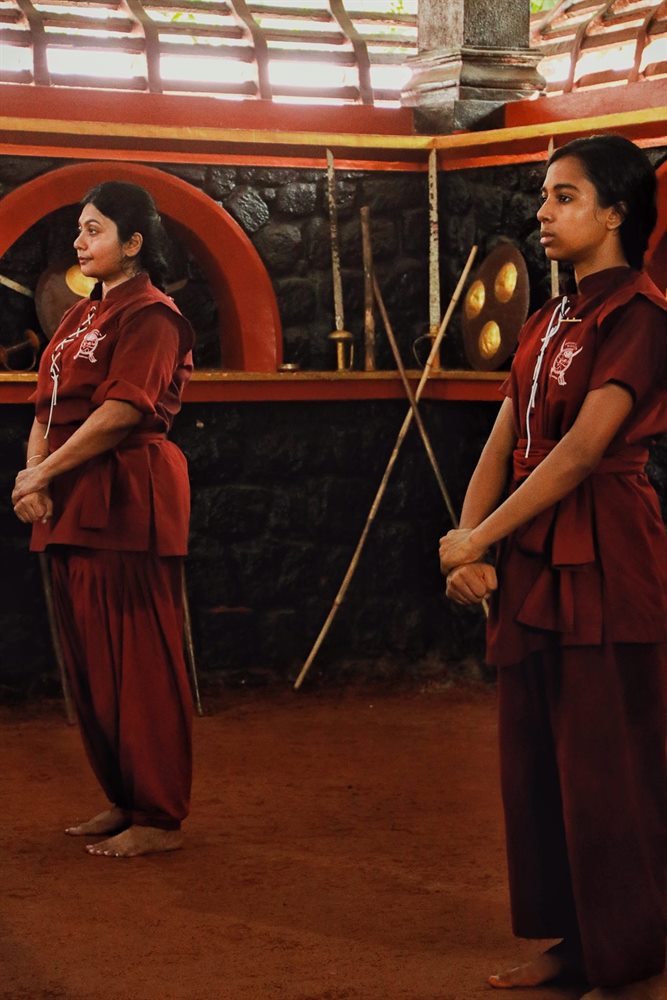 Two students waiting their turn between rounds of practice