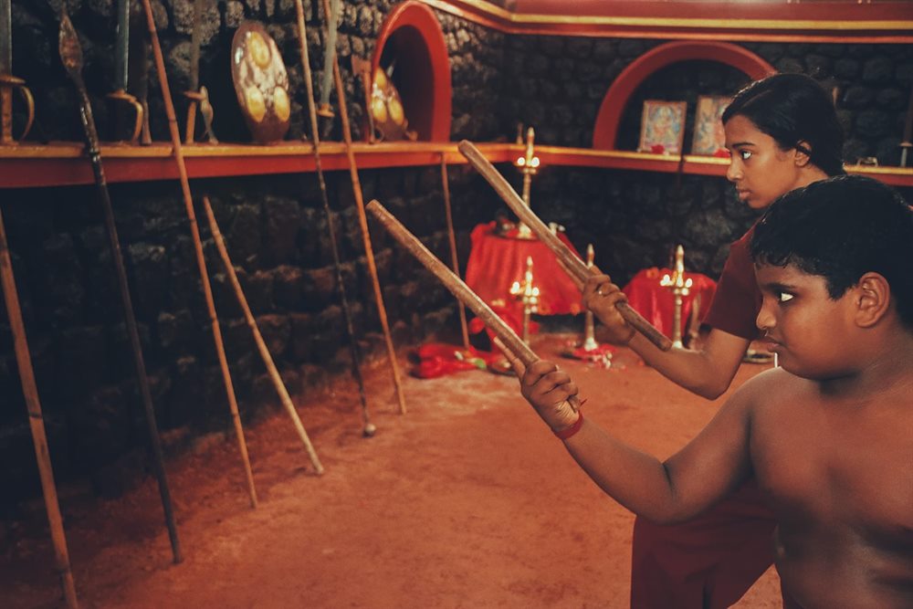 A staff thrust delivered towards a partner across the Kalari floor