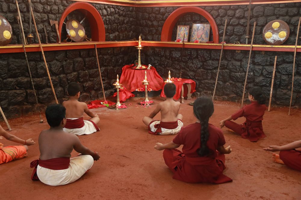 Students seated before the shrine at the close of a session